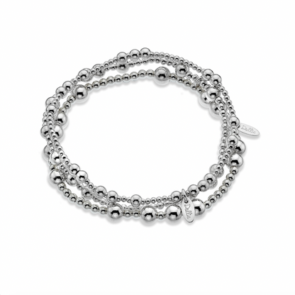 Three Silver beaded bracelet stack on a white background