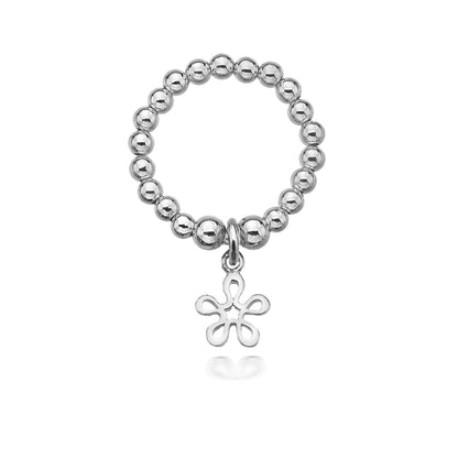 Silver beaded ring with a floral charm on a white background