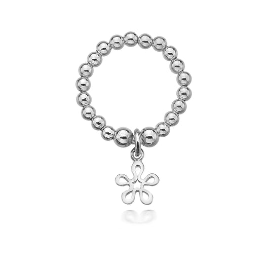 Silver beaded ring with a floral charm on a white background
