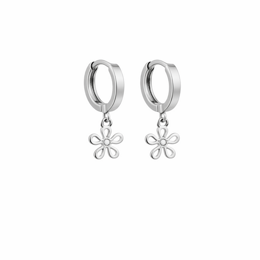 Silver hoop earrings with floral charms on a white background