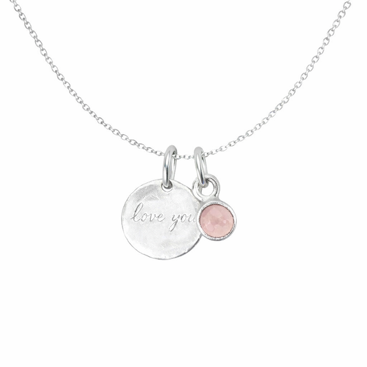Necklace with 'love you' pendant and rose quartz on a white background