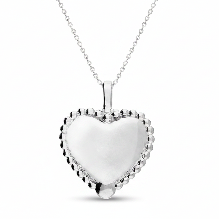 Silver heart-shaped pendant on a white background