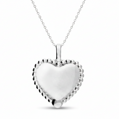 Silver heart-shaped pendant on a white background