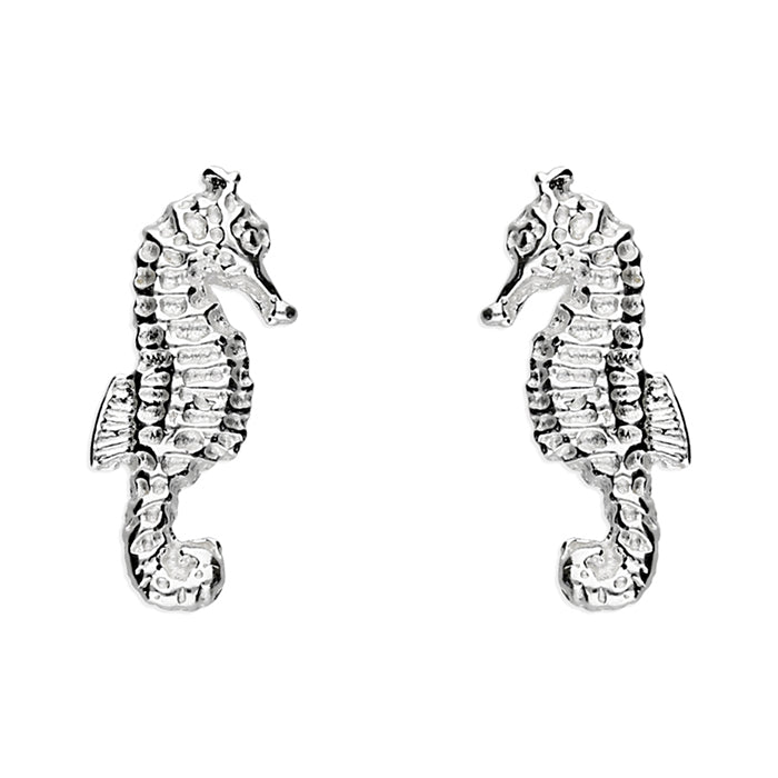 Pair of silver seahorse earrings on a white background