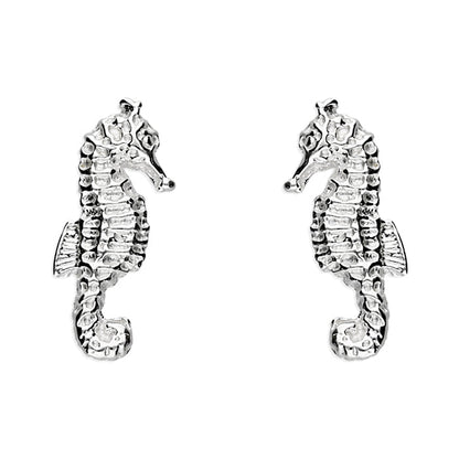 Pair of silver seahorse earrings on a white background