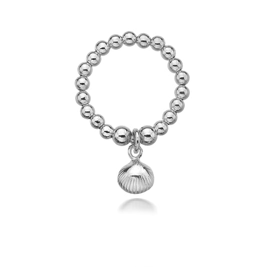 Silver beaded ring with a shell charm on a white background