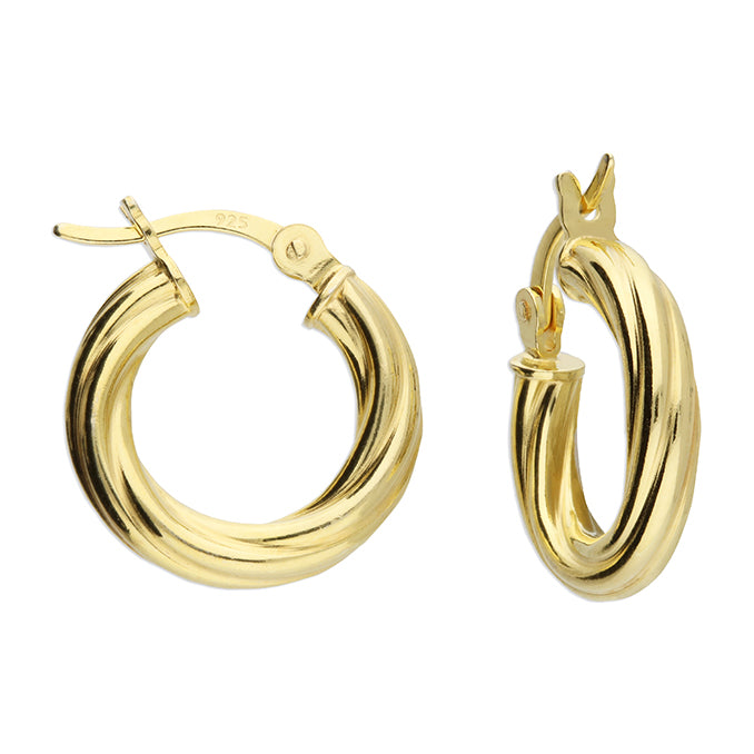 Gold hoop earrings on a white background