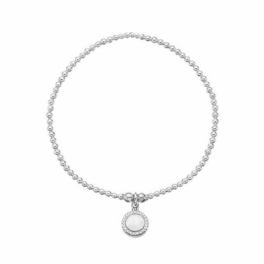 Silver bracelet with a round sparkle disc pendant on a white background