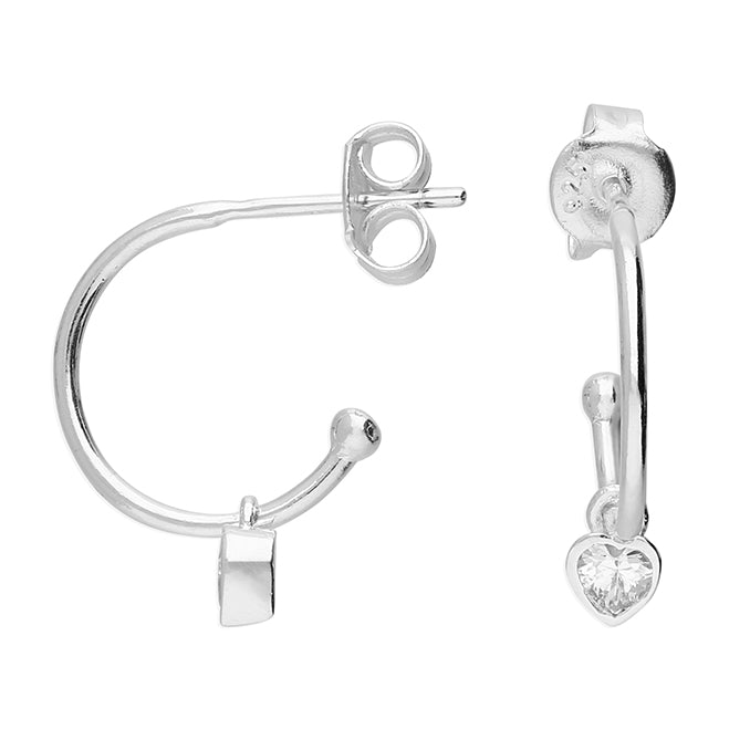 Silver hoop earrings with heart-shaped gemstones on a white background
