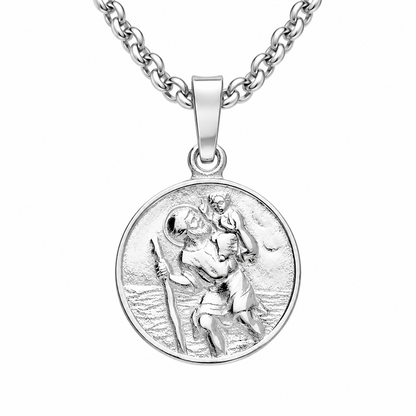 A silver round medallion pendant necklace featuring a detailed relief of Saint Christopher carrying the Christ child across water, suspended from a classic curb chain against a plain white background.