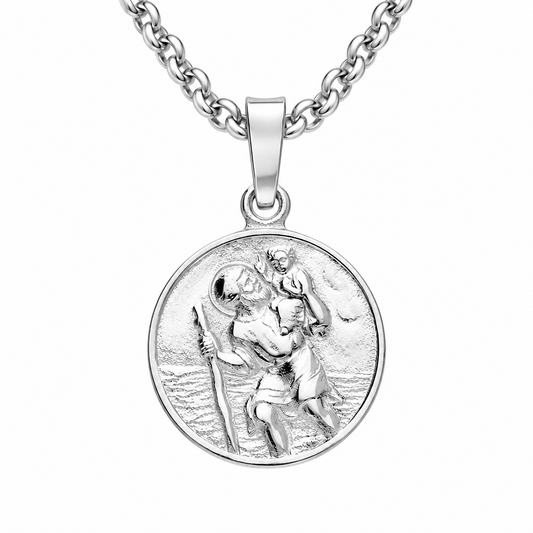 A silver round medallion pendant necklace featuring a detailed relief of Saint Christopher carrying the Christ child across water, suspended from a classic curb chain against a plain white background.