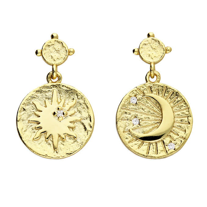 Gold earrings with sun and moon designs on a white background