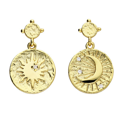 Gold earrings with sun and moon designs on a white background
