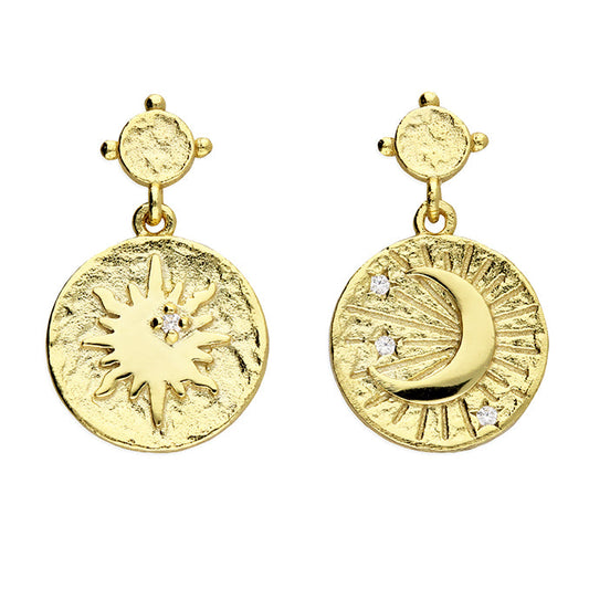 Gold earrings with sun and moon designs on a white background