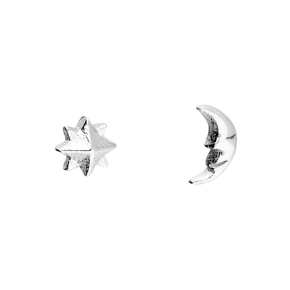 Silver star and moon earrings on a white background