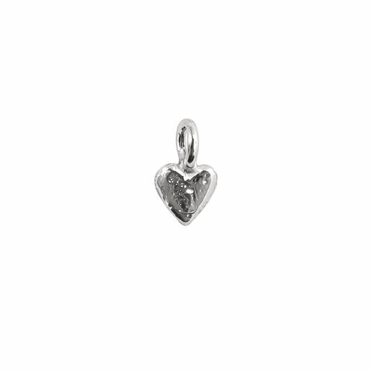 Silver heart-shaped pendant on a white background
