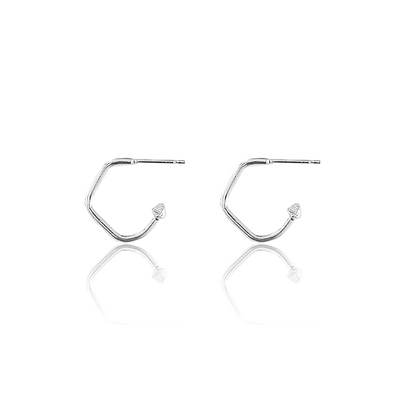 Handmade hoops with charms available on white background 