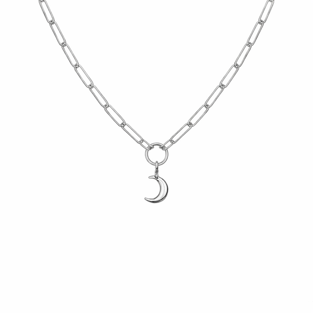 Silver necklace with a crescent moon charm on a white background