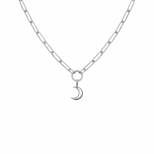 Silver necklace with a crescent moon charm on a white background