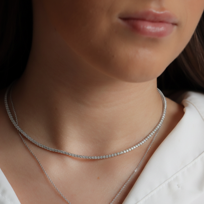 tennis necklace layered up displayed on Iyla 