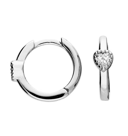 Silver hoop earring and heart-shaped pendant on a white background