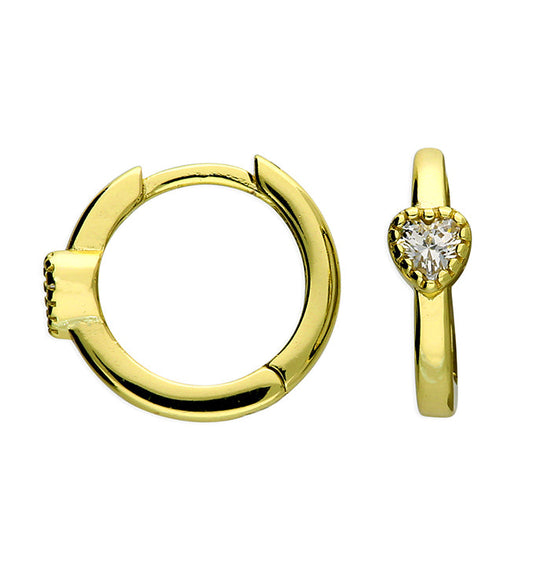 Gold hoop earring and heart-shaped diamond earring on a white background
