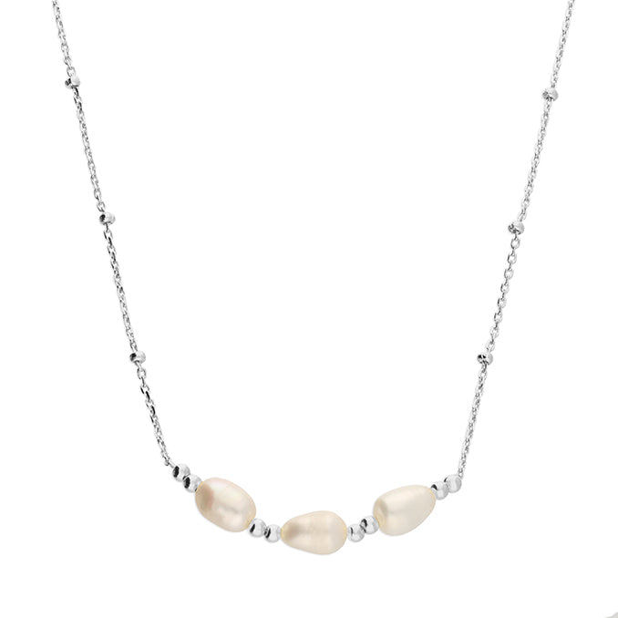 Necklace with three pearl-like beads on a white background