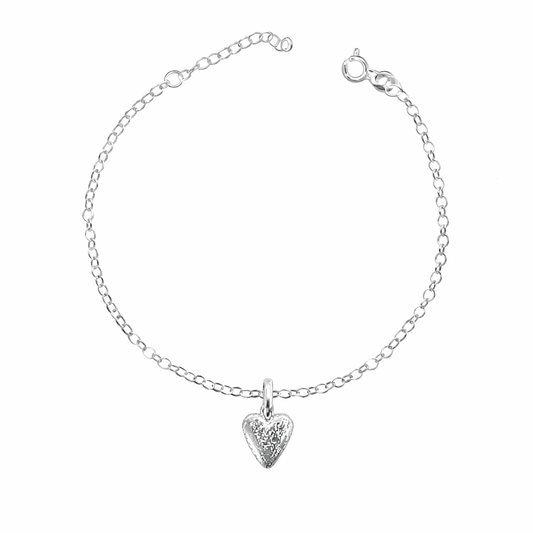 Silver bracelet with a heart-shaped pendant on a white background