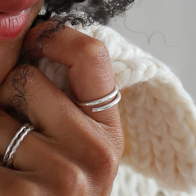 hammered handmade wrap ring displayed on Leanne 