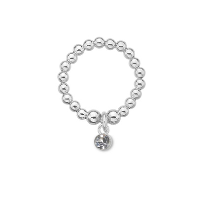 Silver beaded ring with a round charm on a white background