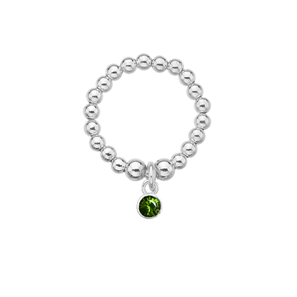 Silver beaded ring with a green gemstone charm on a white background