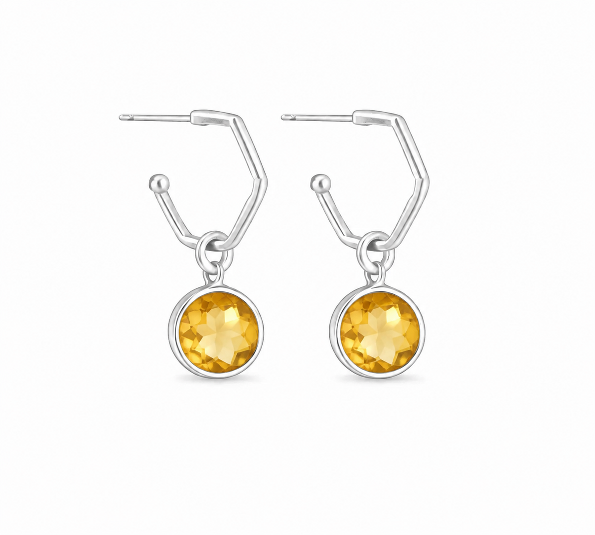 a pair of silver hoops earrings feauting citrine charm hoops on a white background.