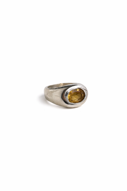 Sterling silver Citrine Treasure Ring with a wide textured band and oval golden-yellow gemstone on a white background