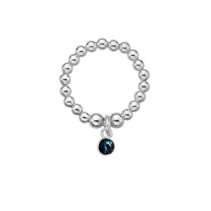 Silver beaded ring with a dark blue charm on a white background