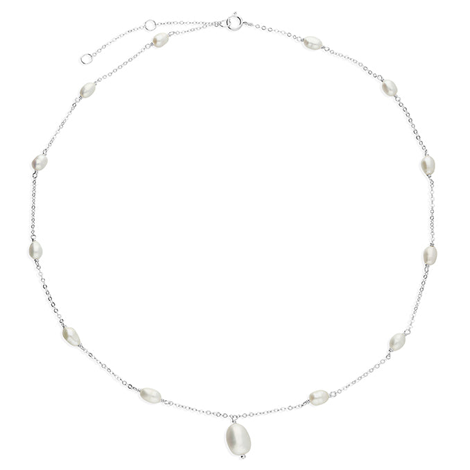 Effie freshwater pearl necklace with pearls spaced along a fine chain and a central pearl drop on a white background