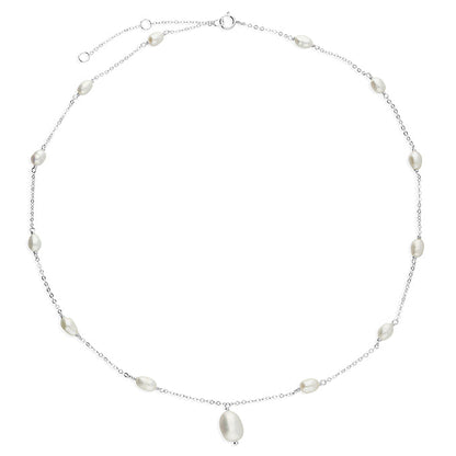 Effie freshwater pearl necklace with pearls spaced along a fine chain and a central pearl drop on a white background