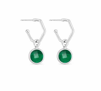 A pair of silver drop earrings featuring a emerald pendants, shown against a plain white background.
