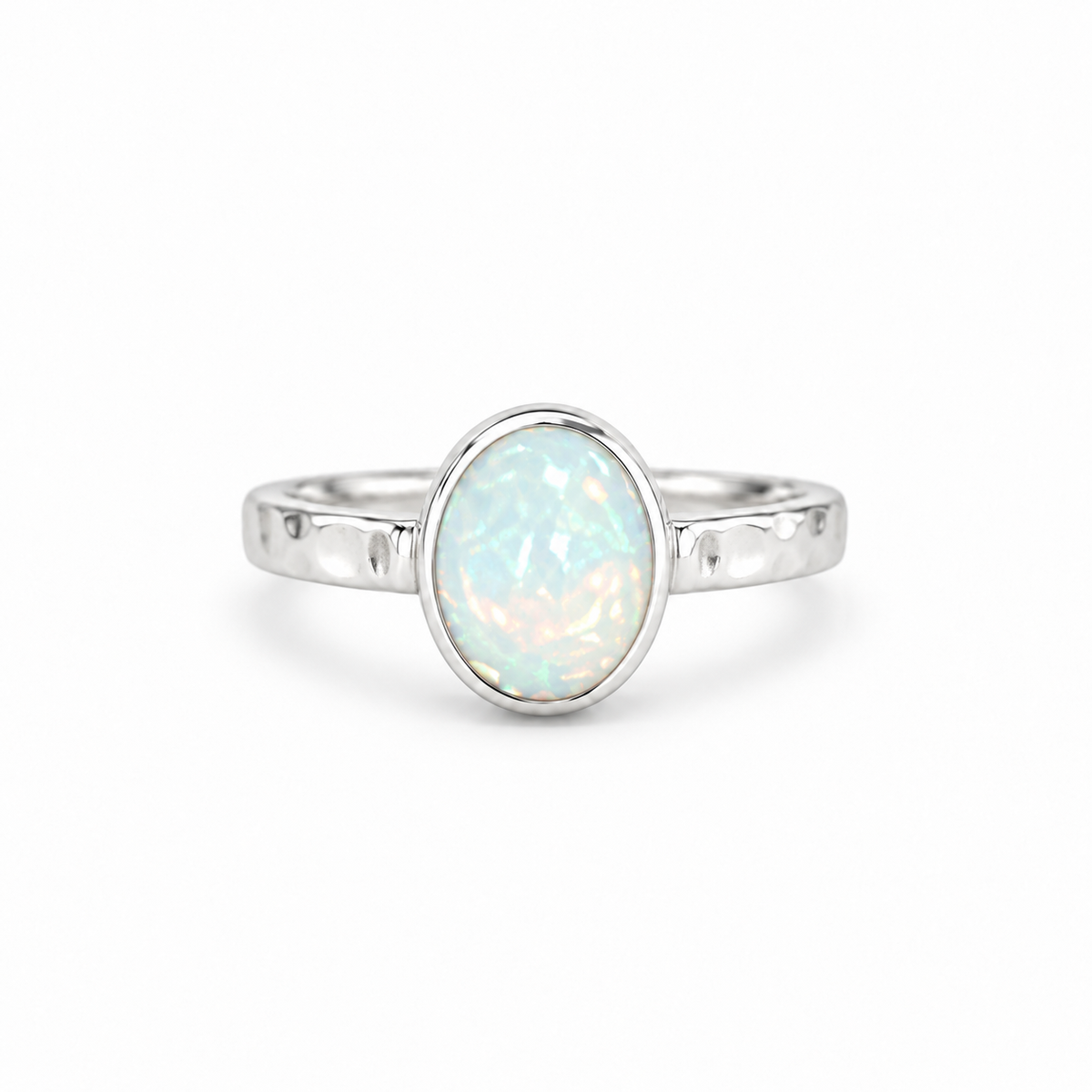 A silver ring featuring an oval-cut white opal gemstone with iridescent blue and pink flashes, set against a clean white background.