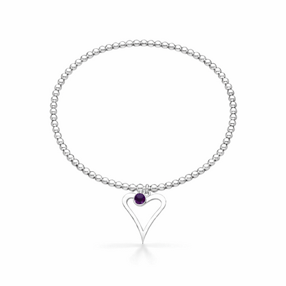 Silver birthstone bracelet with a heart-shaped charm on a white background