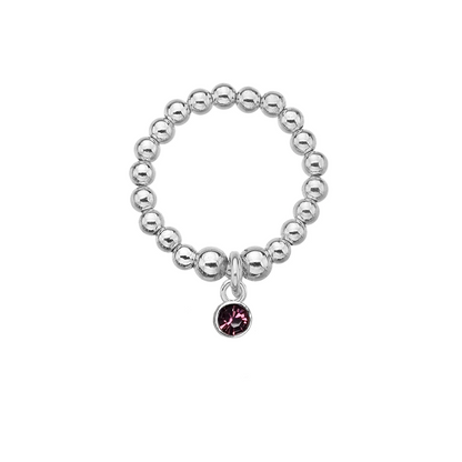 Silver beaded ring with a purple gemstone charm on a white background