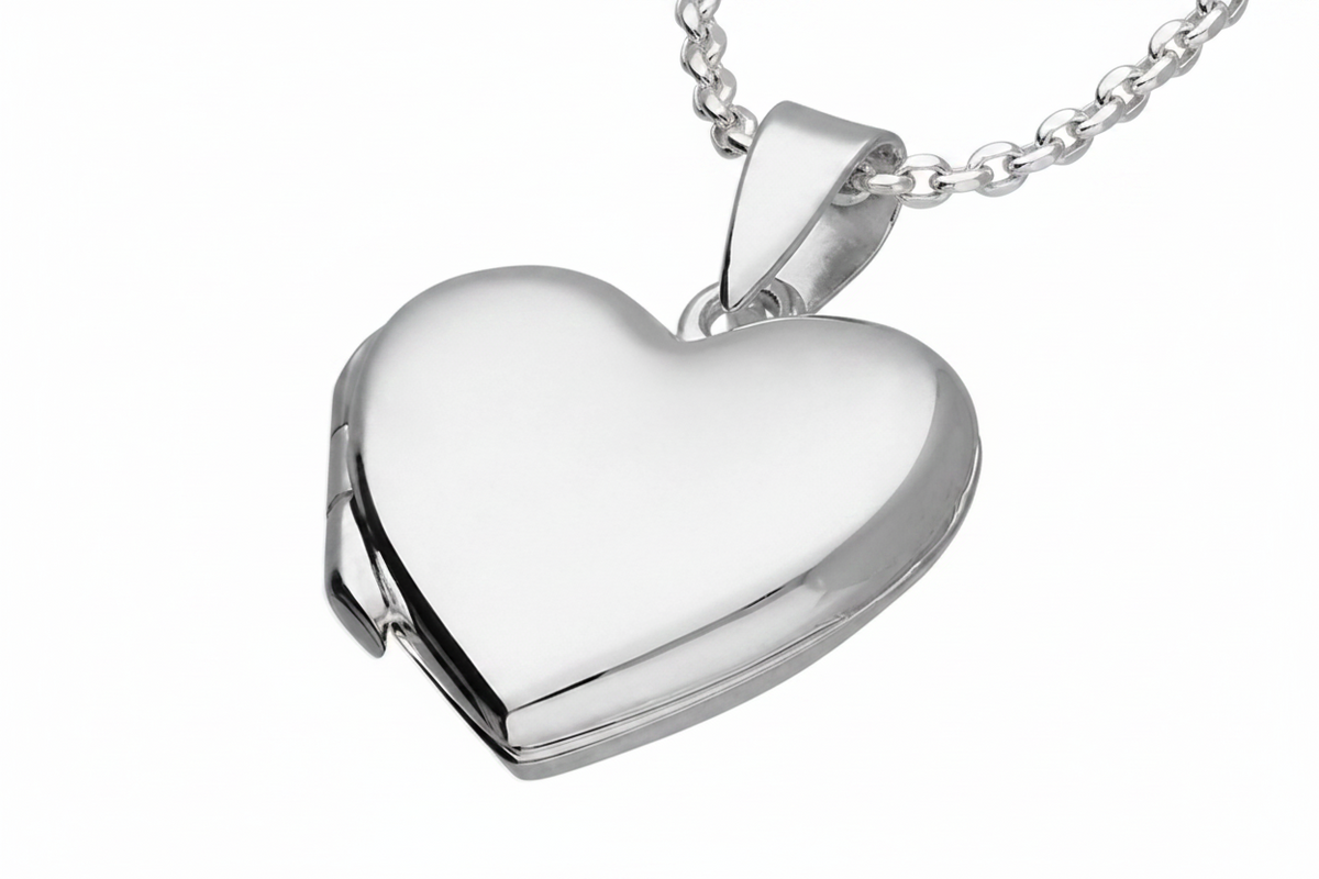 Polished silver-coloured heart locket pendant on a fine chain, shown closed on a white background