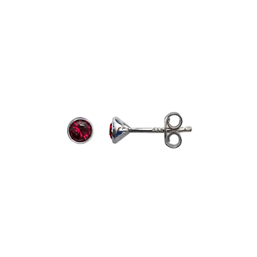 Silver stud earrings with a red gemstone on a white background