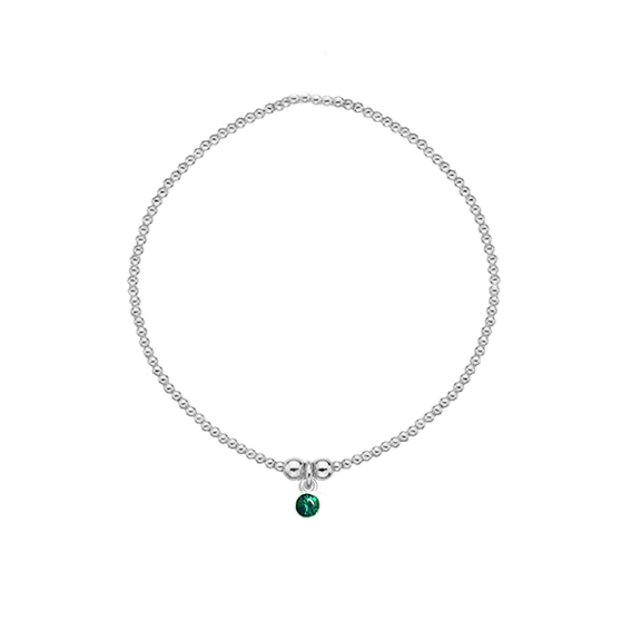 Silver bracelet with a green gemstone on a white background
