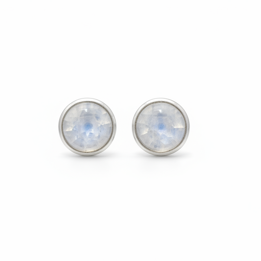 Pair of silver stud earrings with rainbow moonstone stones on a white background