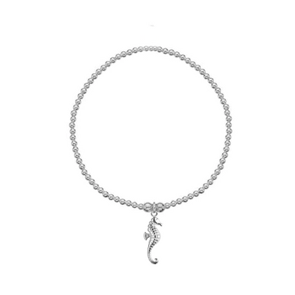 Seahorse charm beaded bracelet on white background 