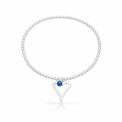 Silver birthstone bracelet with a heart-shaped charm on a white background