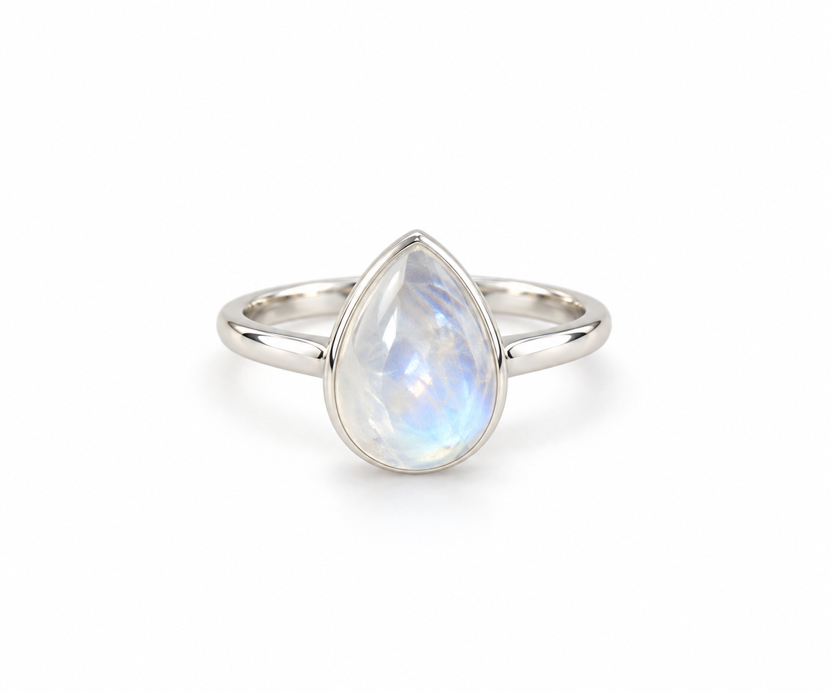 A silver ring featuring a teardrop-shaped iridescent moonstone gemstone, shown on a clean white background.