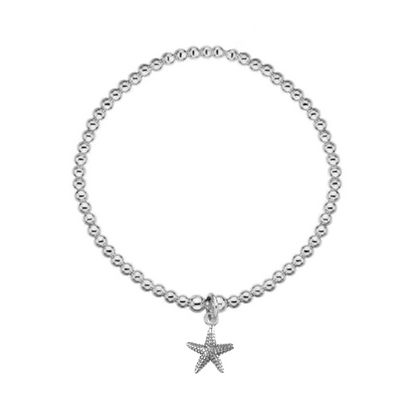 Silver bracelet with a starfish charm on a white background