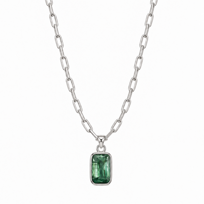 teeny trace necklace with a emerald cut kyanite pendant on a white background 