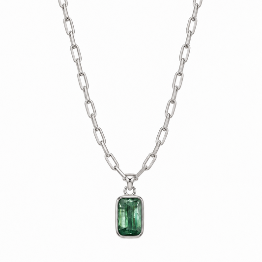 teeny trace necklace with a emerald cut kyanite pendant on a white background 